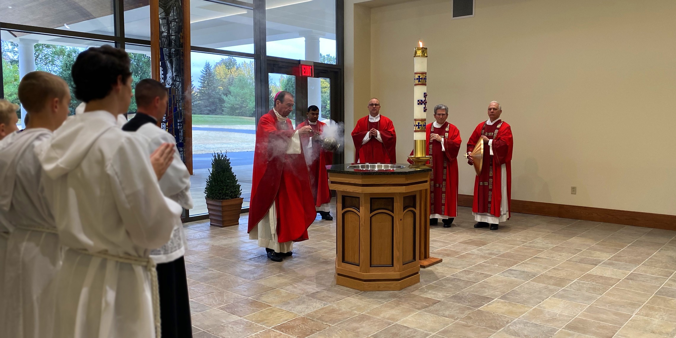 Archbishop Schnurr blessing new Baptismal font